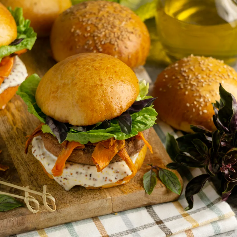 few burgers with some salad and patty in it