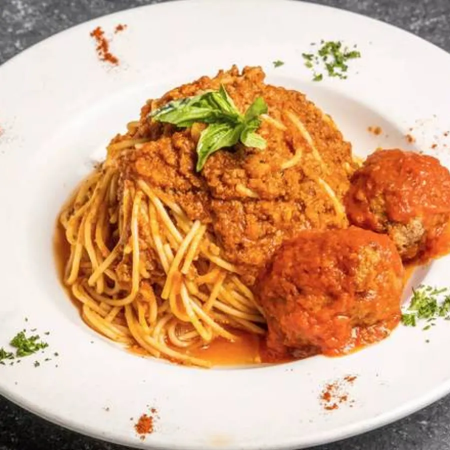 Spaghetti Bolognese with basil leaves topping